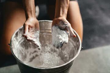 Woman clapping hands and preparing for workout at a gym