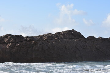 The sea demonstrating its power against the cliffs