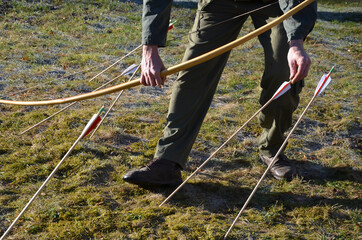 The archer collects stuck arrows at the bow for another series of shots attacks from a yew...