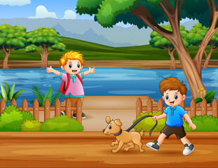 Happy boys walking in the riverside