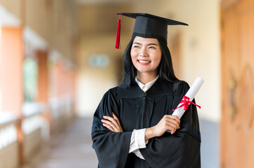 Portrait Stand alone of female student Happy  and celebrating her graduation of social distancing