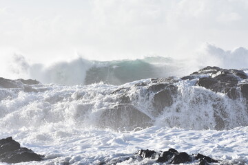 The sea demonstrating its power against the cliffs
