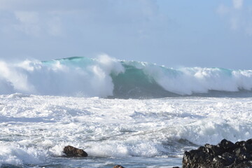 The sea demonstrating its power against the cliffs