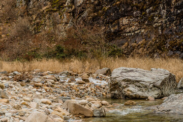 Large granite boulders in mountain stream