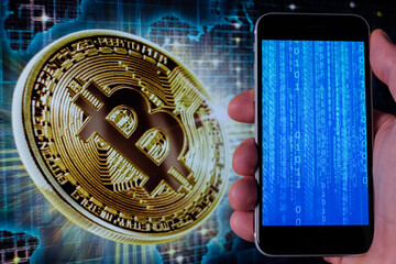 Bitcoin and cryptocurrency investing concept. Mobile phone application to trade Bitcoin BTC in...