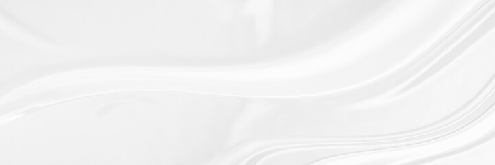 White gray satin texture that is white silver fabric silk panorama background with beautiful soft blur pattern natural.