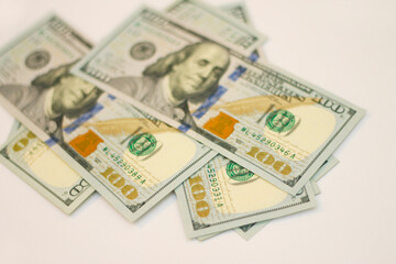 Stacks of paper 100 dollars USA on the white background