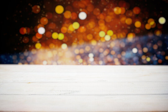 Wooden board empty table in front of blurred background. Perspective brown wood over blurt - can be used for display or montage your products.