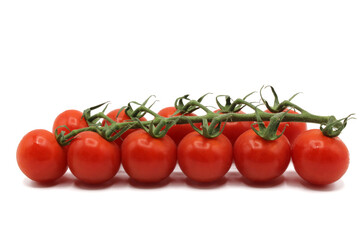 Cherry tomatoes in deep red branch