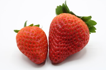 Two strawberries isolated on a white background