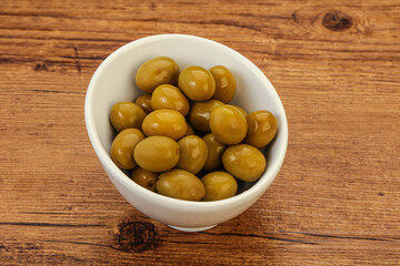 Green pickled olives in the bowl