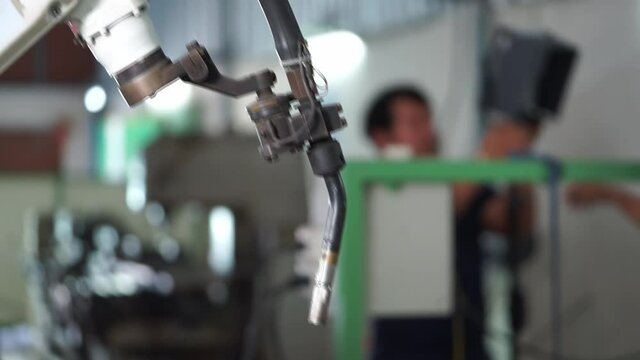 Robot prepared for welding in the factory.