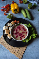 Healthy food ingredient chicken soup prepared with white oil and beetroot. Top view, selective focus