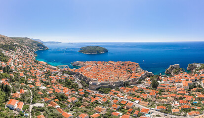 Aerial drone shot of Otok Lokrum in Adriatic sea near Dubrovnik old town in Croatia summer noon