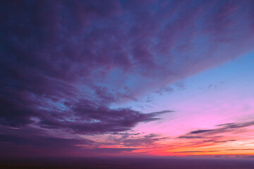 Colorful cloudy sky at sunset. Gradient color. Sky texture. Abstract nature background
