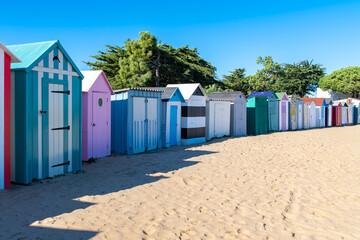 Naklejka premium Wooden beach cabins on the Oleron island in France, colorful huts 