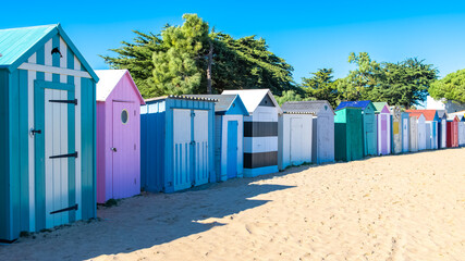 Wooden beach cabins on the Oleron island in France, colorful huts
