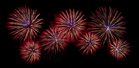 Fireworks with different color and pattern for celebration in various events including new year, party, ceremony, birthday or other show and display on night dark sky background.