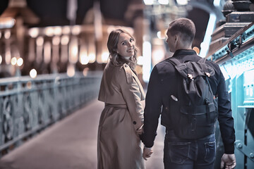 spring walk guy and girl back view, couple walks in the city seasonal view