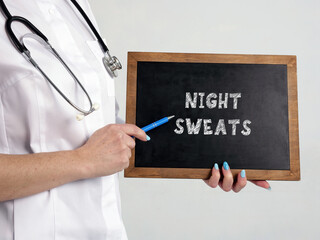 Medical concept meaning NIGHT SWEATS with phrase on the chalkboard