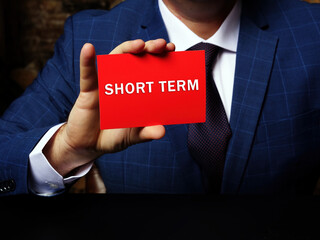  Financial concept about SHORT TERM with phrase on the piece of paper. Business concept about...