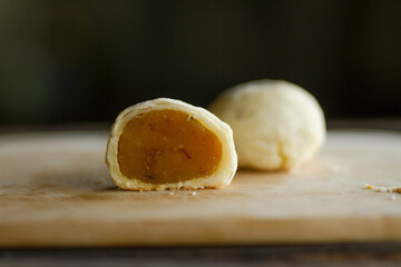 Cut half of chinese cake with custard inside. making chinese cake ball at bakery