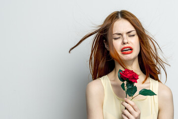 sad woman with rose flower displeasure sadness cropped view studio