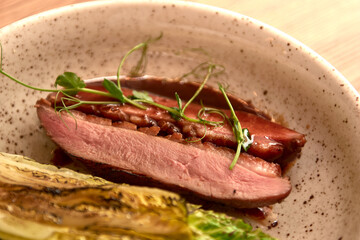 Entrecote Beef Grilled steak meat on wooden cutting boardon with lattuce branch, pepper and salt .