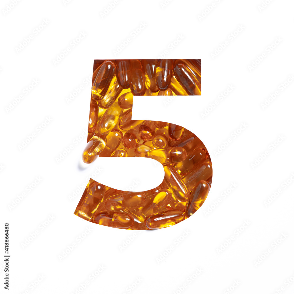 Wall mural Omega supplement. Number five made of fish oil pills and paper cut in shape of fifth numeral isolated on white