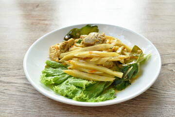 spicy stir fried bamboo shoot and chicken with curry on plate