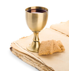 Holy Bible with bread and chalice of wine on white background