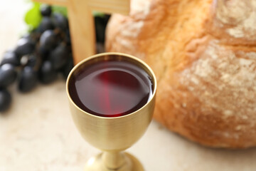 Chalice of wine on table, closeup
