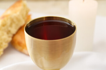 Chalice of wine on table, closeup