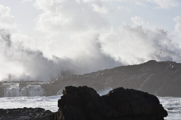 The sea demostrating its power against the cliffs