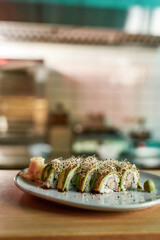 Rice and fish sushi on a table in a restaurant