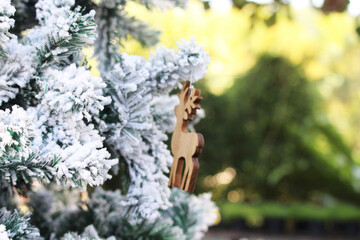 Naklejka premium New year background image decorated with deer and trees and snow