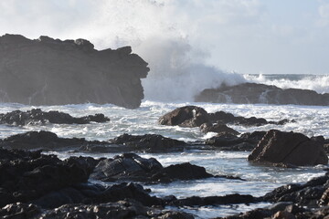 The sea demostrating its power against the cliffs