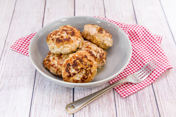 Several juicy meat patties for a family dinner on the table