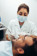 Dentist working on patient's teeth