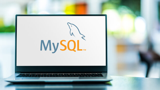 Laptop computer displaying logo of MySQL