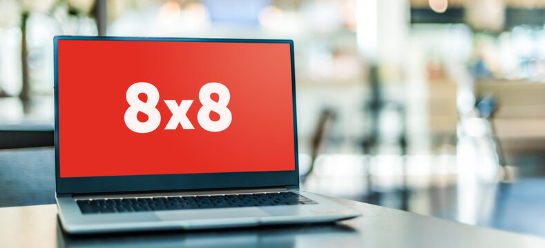 Laptop computer displaying logo of 8x8 Inc.