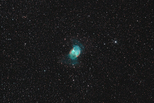 Planetary nebula in the deep sky at night Messier 27
