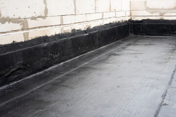 Waterproofing flat roof terrace with roll bitumen