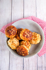 Several juicy fish cakes for a family dinner on the table