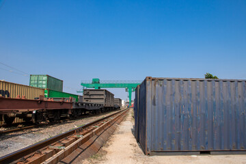 A container on the side of a railway track.