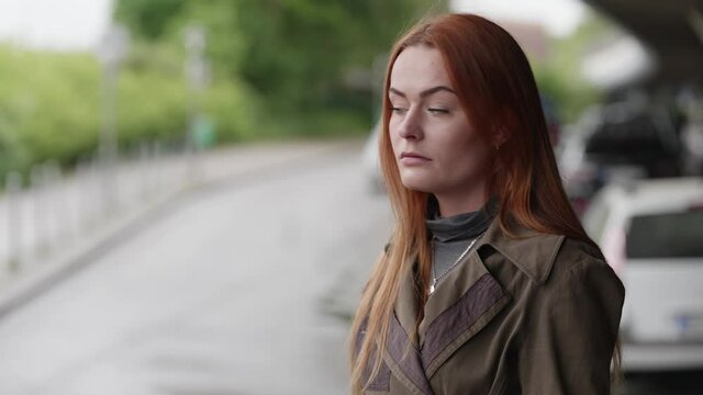 [4k] young beautiful hostile arrogant ginger woman looking at camera