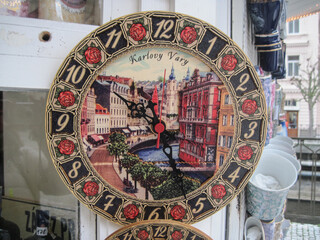 old clock on the wall. Beautiful clock with ancient city scape of ornate historic buildings in the...