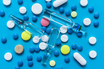 Medical background Lots of pills Blue background Top view