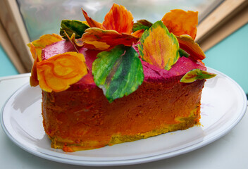 Cake With Colourful Autumn Leaves Decoration And Frosting