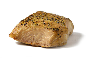 Appetizing baked meat with black pepper isolated on white background close-up